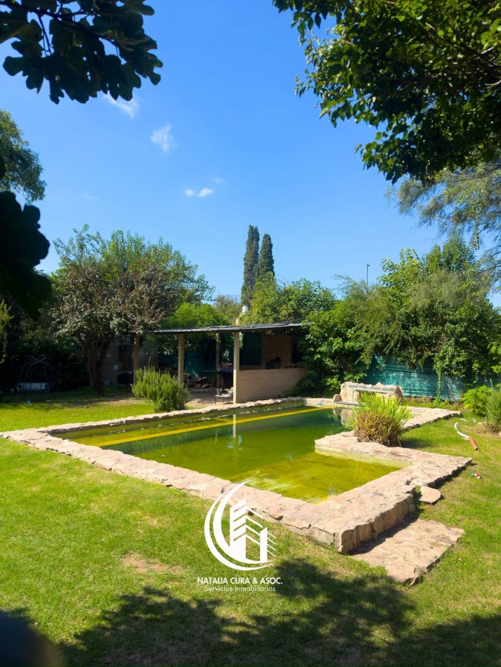 Arguello: Oasis Natural de 1.400 m² con Potencial para 5 Viviendas