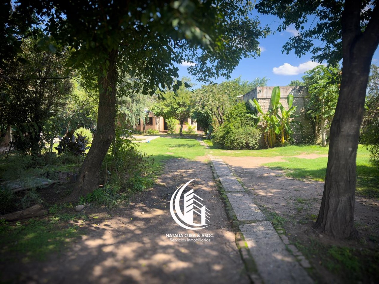 Arguello: Oasis Natural de 1.400 m² con Potencial para 5 Viviendas