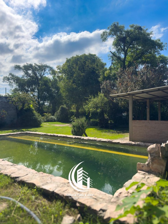 Arguello: Oasis Natural de 1.400 m² con Potencial para 5 Viviendas