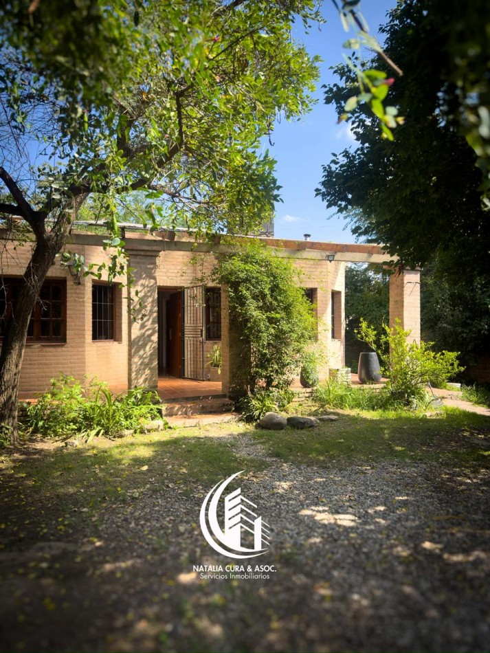 Arguello: Oasis Natural de 1.400 m² con Potencial para 5 Viviendas