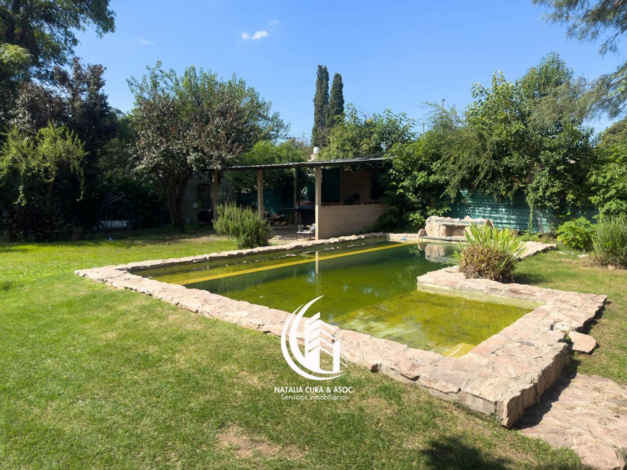 Arguello: Oasis Natural de 1.400 m² con Potencial para 5 Viviendas